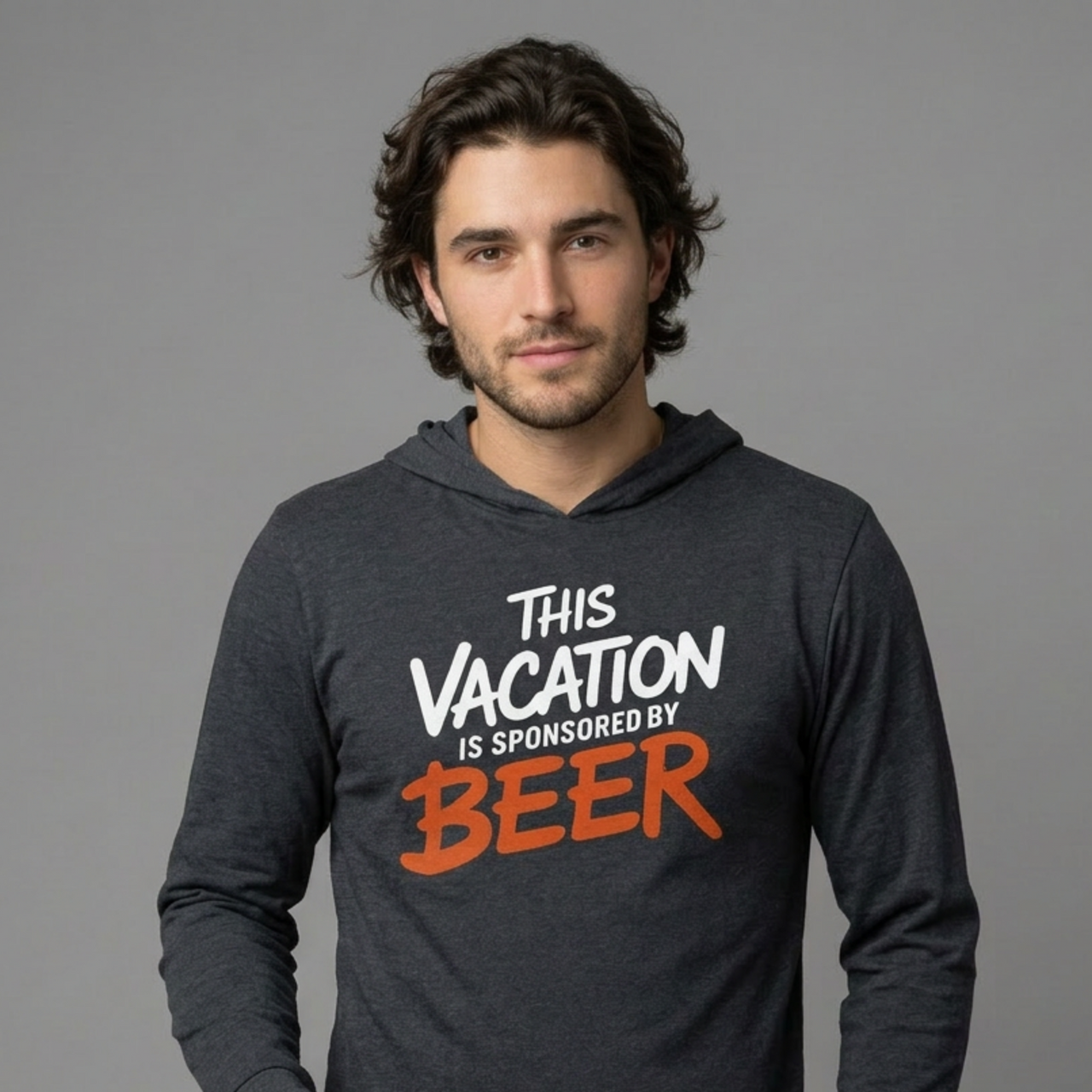 Man wearing a heather navy lightweight hoodie with text 'This vacation is sponsored by beer' funny spring break,beach trip, lake season, or bachelor bachelorette trip design