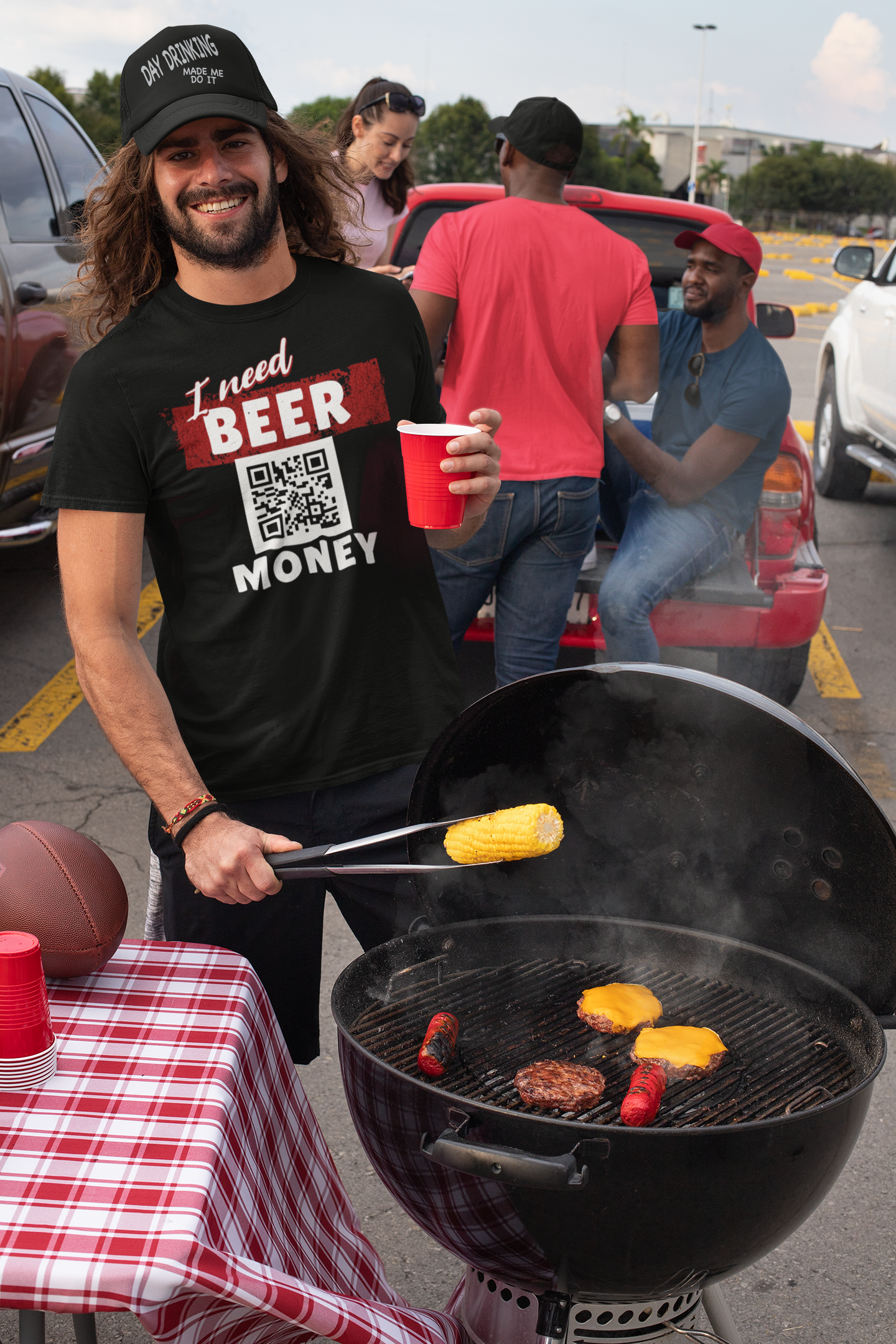 man wearing i need beer money tshirt at a barbecue. Part of our qr code apparel line. Available on hoddies, tshirts, sweatshirts and more.