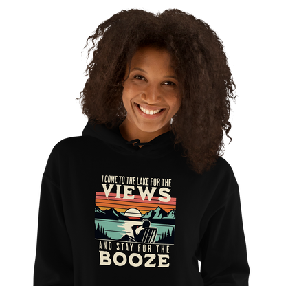 Hoodie featuring "I Come to the Lake for the Views and Stay for the Booze," with a man in a beach chair by the lake and a retro sunset.
