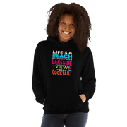 Hoodie with the phrase "Life's a Beach but I Prefer It with a Lakeside View and a Cocktail" in vibrant colors.