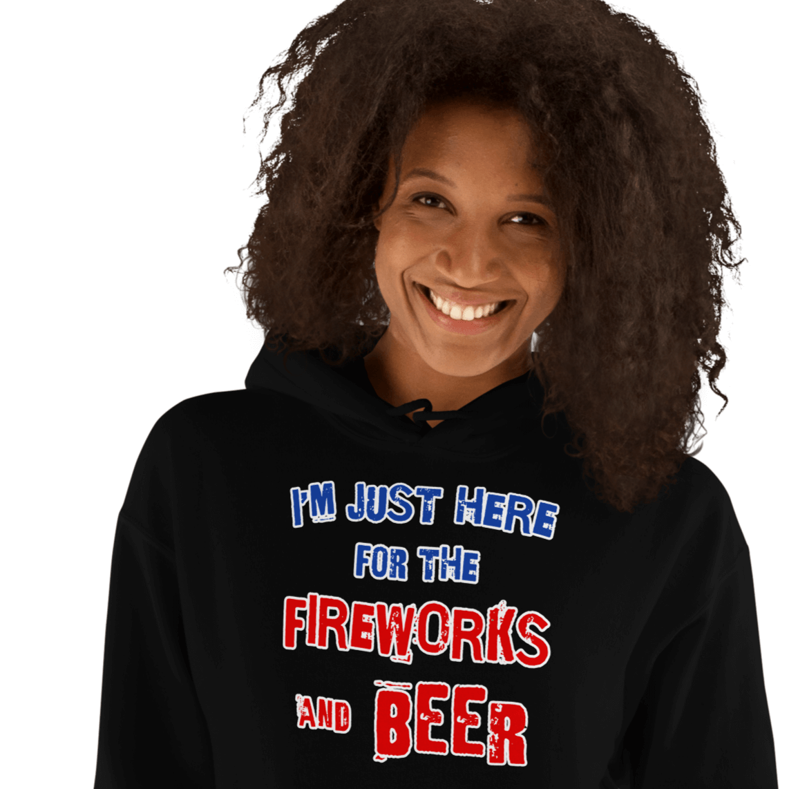 Woman wearing "I'm Just Here for the Fireworks and Beer" cozy black hoodie with a joyful smile.