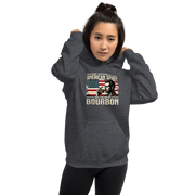 Hoodie with 'This Shirt Contains 100% American Spirit and a Splash of Bourbon' text, man drinking a glass of bourbon, and distressed American flag background