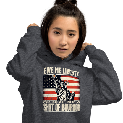 Hoodie with Give Me Liberty or Give Me a Shot of Bourbon text, Statue of Liberty holding a shot glass, and distressed American flag background. Perfect for 4th of July.