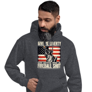 Hoodie with 'Give Me Liberty or Give Me a Fireball Shot' text, Statue of Liberty holding a shot glass, and distressed American flag background. Perfect for 4th of July.