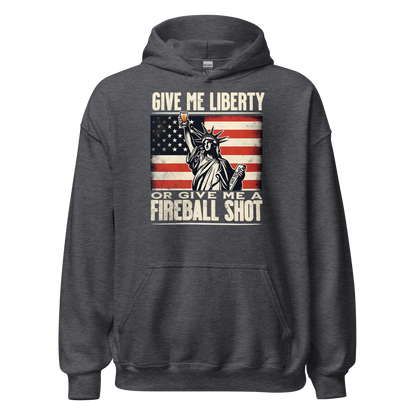 Hoodie with 'Give Me Liberty or Give Me a Fireball Shot' text, Statue of Liberty holding a shot glass, and distressed American flag background. Perfect for 4th of July.