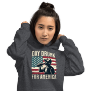 Hoodie with Day Drunk for America text, silhouette of a man drinking a bottle of beer, and distressed American flag background. Perfect for 4th of July.