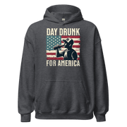 Hoodie with Day Drunk for America text, silhouette of a man drinking a bottle of beer, and distressed American flag background. Perfect for 4th of July.