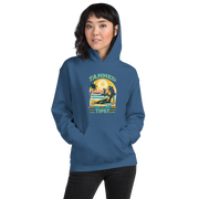 Woman on beach at sunset in our 'Tanned and Tipsy' hoodie, combining vintage charm with beach drinking fun, ideal for cooler evenings.