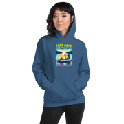 Hoodie with "Lake Days Are Made for Sipping and Dipping," showing a woman on a tube float with a cocktail, lake and sunset scene.