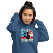 4th of July Hoodie with '100% American Drunkard' text, man drinking a bottle of beer wearing a trucker hat, and distressed American flag background