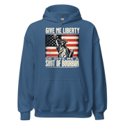 Hoodie with Give Me Liberty or Give Me a Shot of Bourbon text, Statue of Liberty holding a shot glass, and distressed American flag background. Perfect for 4th of July.