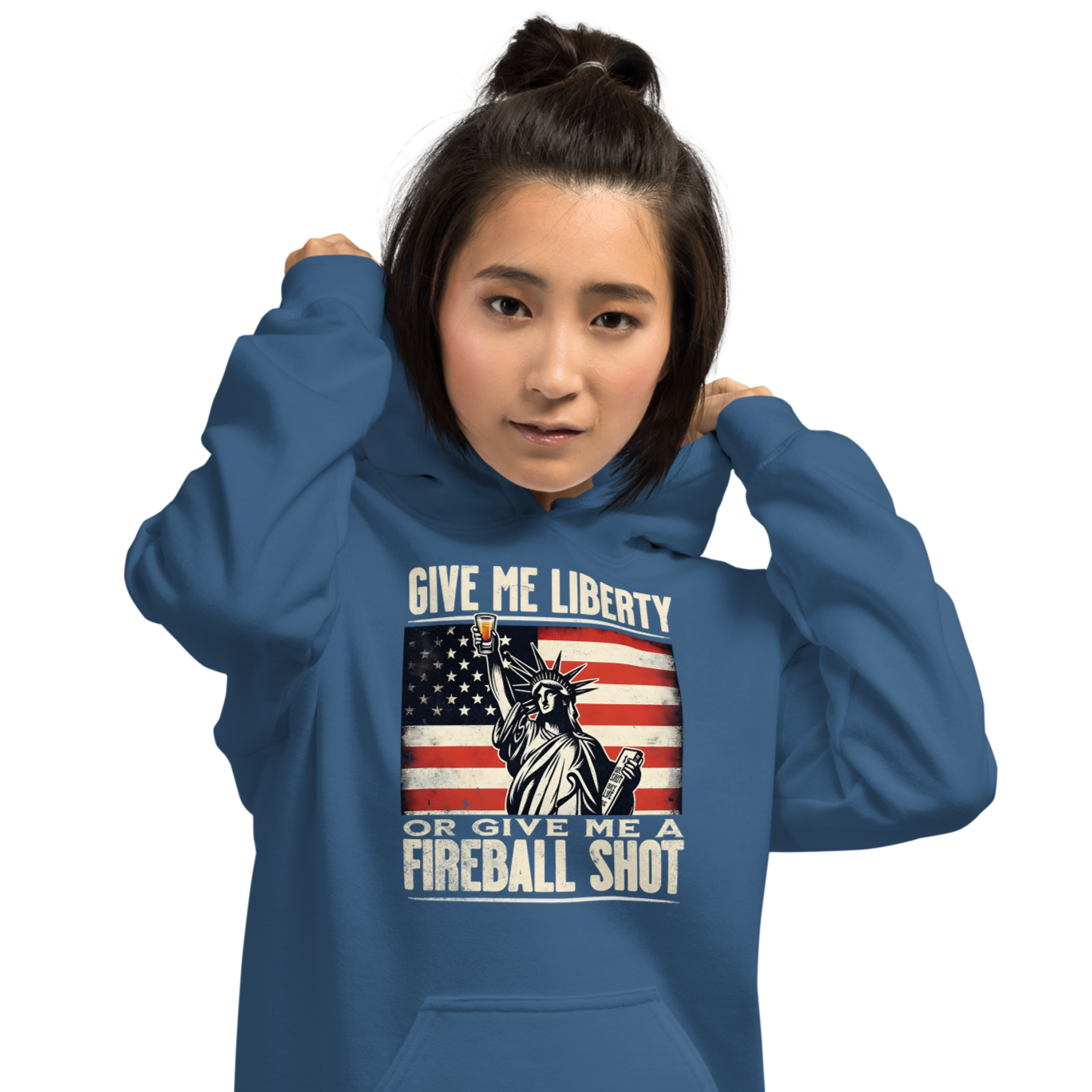 Hoodie with 'Give Me Liberty or Give Me a Fireball Shot' text, Statue of Liberty holding a shot glass, and distressed American flag background. Perfect for 4th of July.