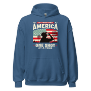 Hoodie with Celebrating America One Shot at a Time text, silhouette of a man drinking a shot, and distressed American flag background. Perfect for 4th of July.