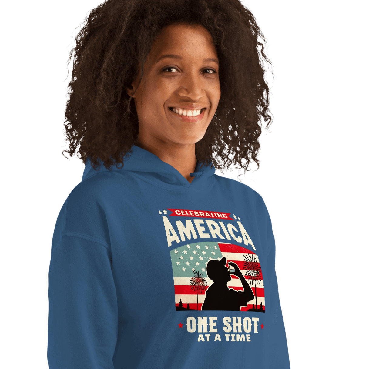 Hoodie with Celebrating America One Shot at a Time text, silhouette of a man drinking a shot, and distressed American flag background. Perfect for 4th of July.