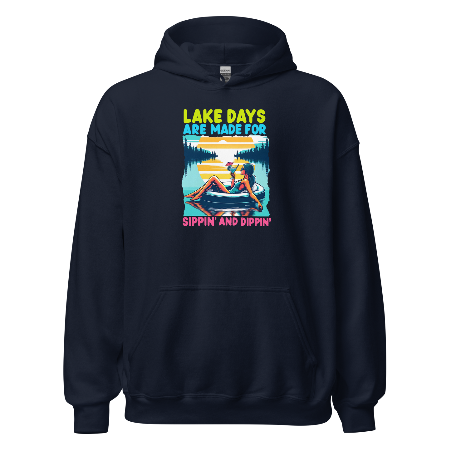 Hoodie with "Lake Days Are Made for Sipping and Dipping," showing a woman on a tube float with a cocktail, lake and sunset scene.