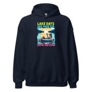 Hoodie with "Lake Days Are Made for Sipping and Dipping," showing a woman on a tube float with a cocktail, lake and sunset scene.