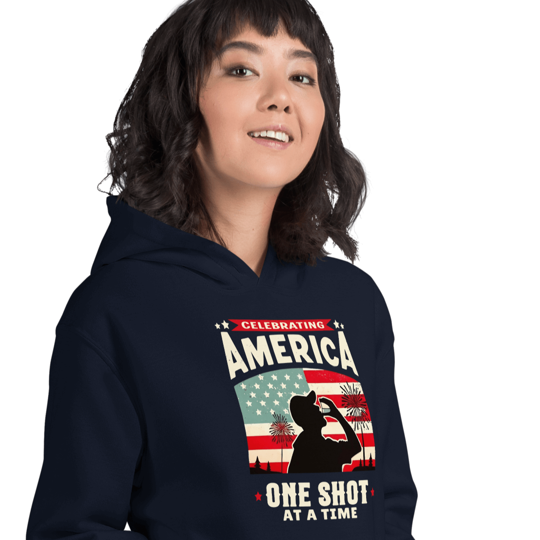 Hoodie with Celebrating America One Shot at a Time text, silhouette of a man drinking a shot, and distressed American flag background. Perfect for 4th of July.