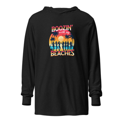 Cozy up in our 'Boozin' with My Beaches' Hoodie, perfect for beach evenings. Retro sunset and cocktails design.