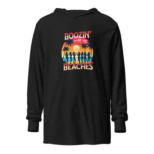 Cozy up in our 'Boozin' with My Beaches' Hoodie, perfect for beach evenings. Retro sunset and cocktails design.