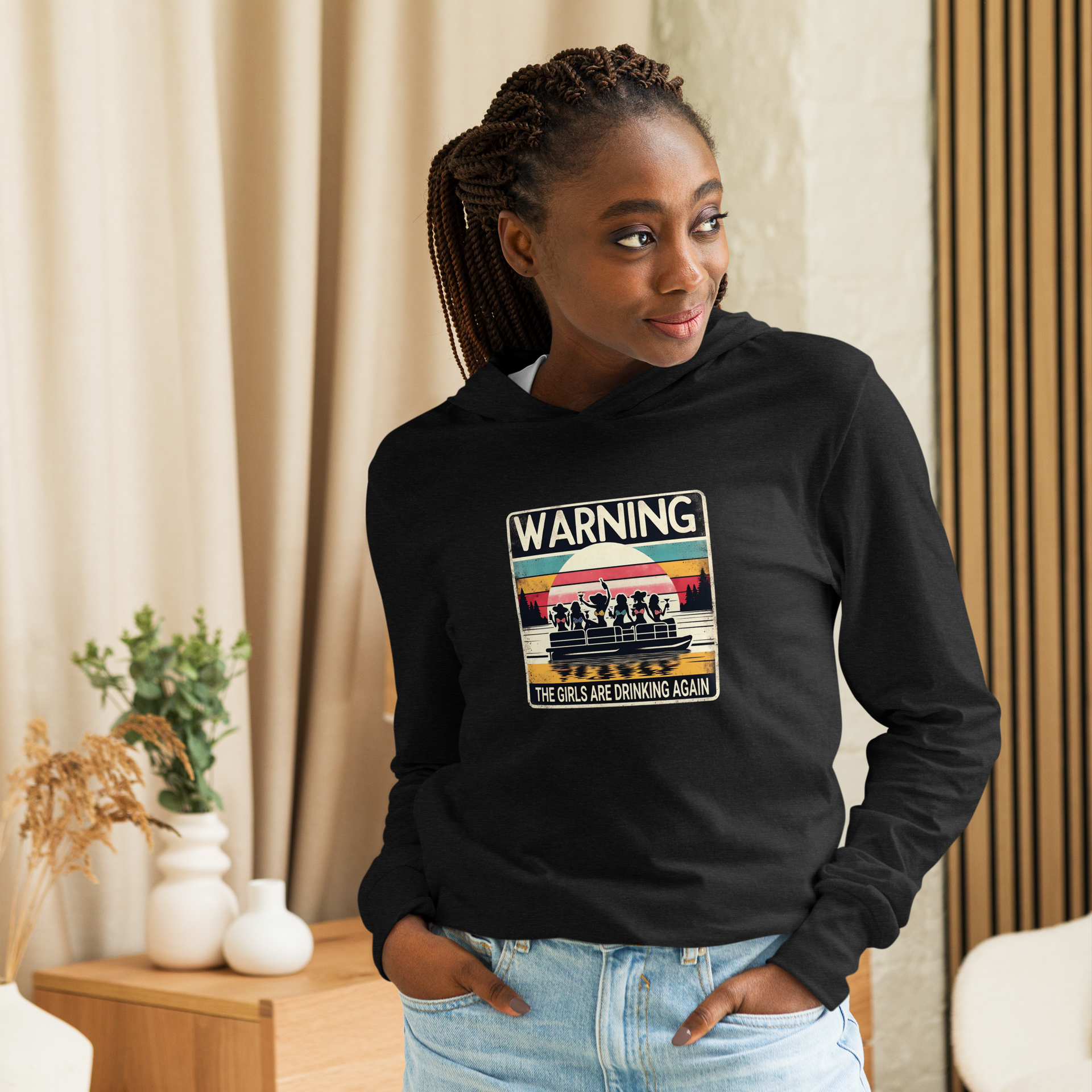 Lightweight hoodie with "Warning: The Girls Are Drinking Again" and girls on a pontoon boat under a retro sunset.