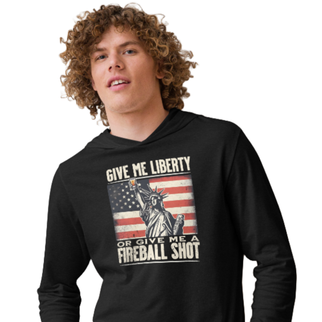 Lightweight hoodie with 'Give Me Liberty or Give Me a Fireball Shot' text, Statue of Liberty holding a shot glass, and distressed American flag background. Perfect for 4th of July."