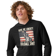 Lightweight hoodie with 'Give Me Liberty or Give Me a Fireball Shot' text, Statue of Liberty holding a shot glass, and distressed American flag background. Perfect for 4th of July."