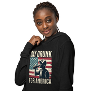 Lightweight hoodie with Day Drunk for America text, silhouette of a man drinking a bottle of beer, and distressed American flag background. Perfect for 4th of July.