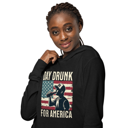 Lightweight hoodie with Day Drunk for America text, silhouette of a man drinking a bottle of beer, and distressed American flag background. Perfect for 4th of July.