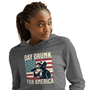 Lightweight hoodie with Day Drunk for America text, silhouette of a man drinking a bottle of beer, and distressed American flag background. Perfect for 4th of July.