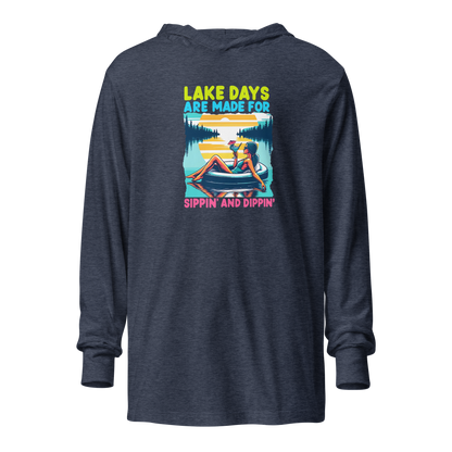 Lightweight hoodie with "Lake Days Are Made for Sipping and Dipping," featuring a woman on a tube float, lake and sunset.