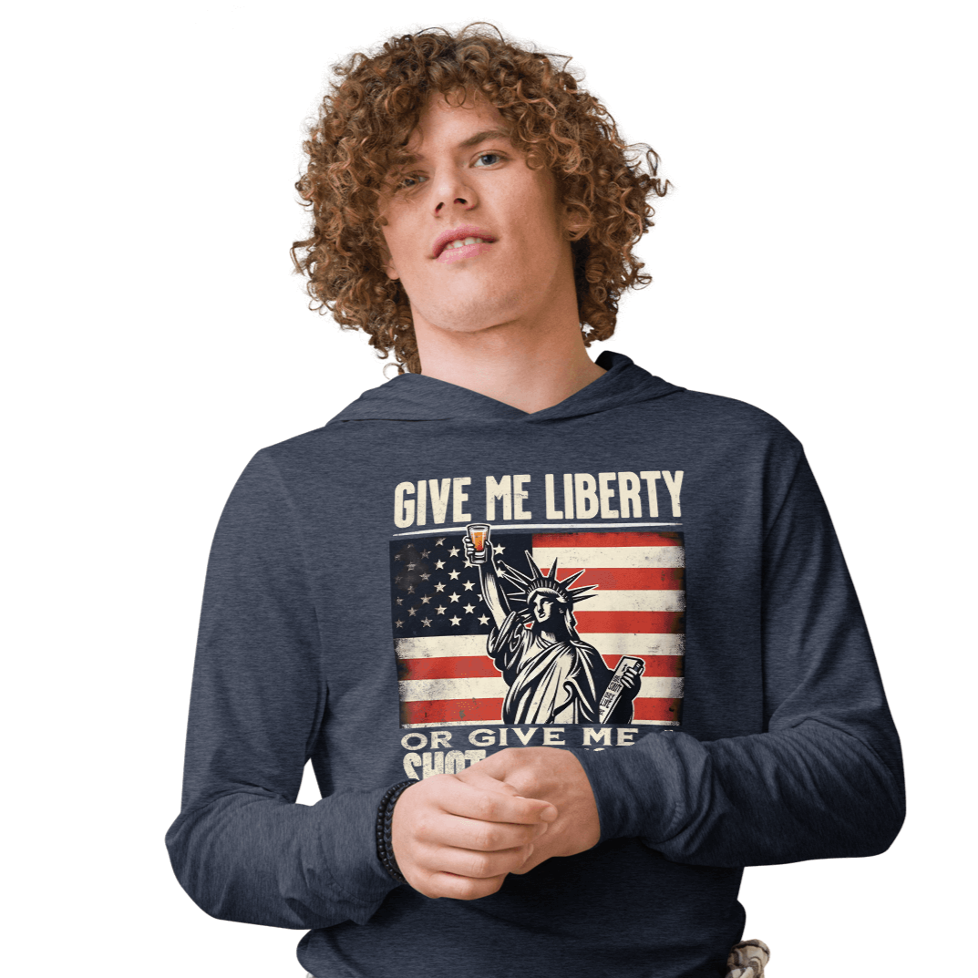 Lightweight hoodie with Give Me Liberty or Give Me a Shot of Tequila text, Statue of Liberty holding a shot glass, and distressed American flag background. Perfect for 4th of July.