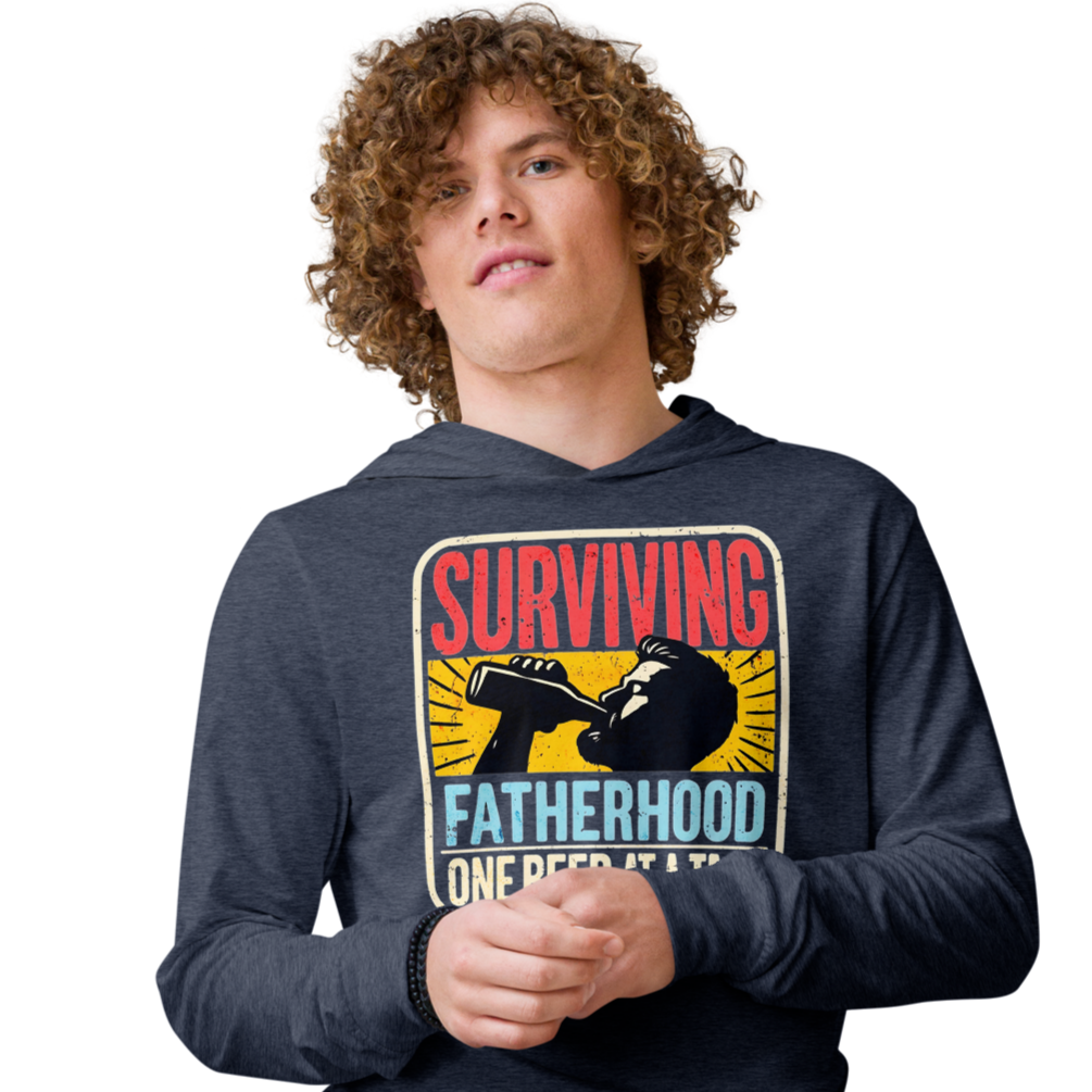 Celebrate fatherhood with our "Surviving Fatherhood One Beer at a Time" lightweight hoodie. Perfect gift for dads on Father's Day or any occasion.