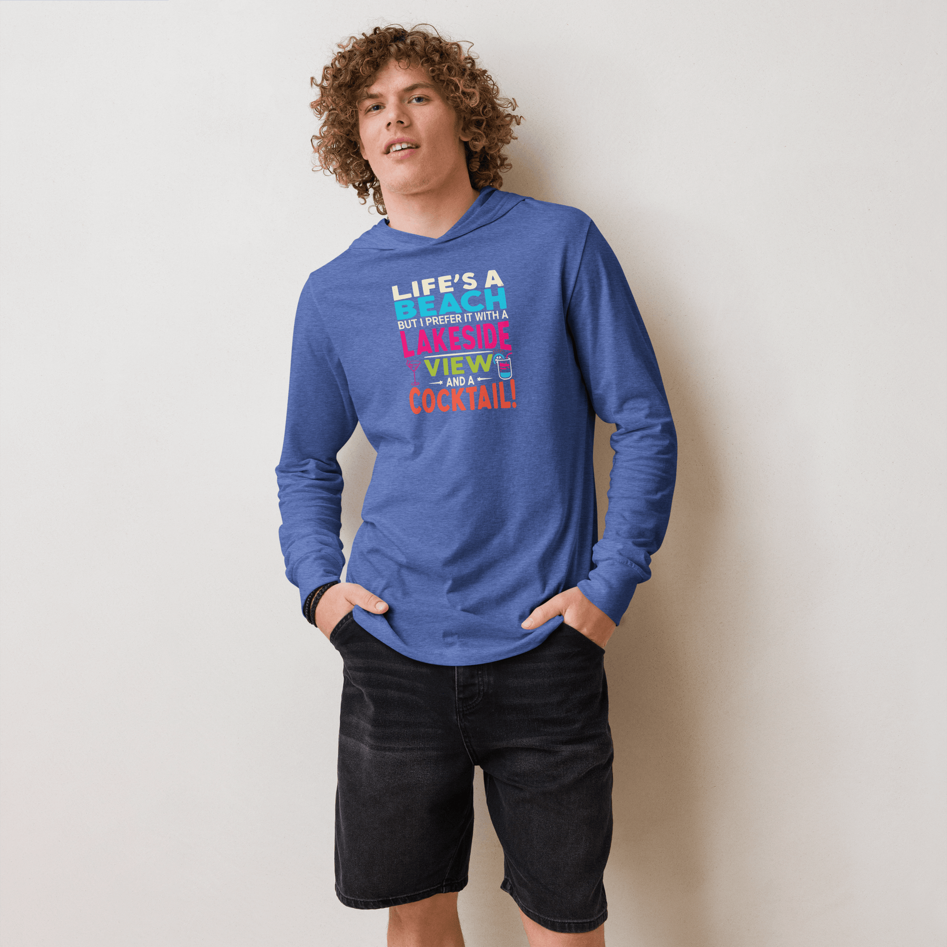 Lightweight hoodie with the phrase "Life's a Beach but I Prefer It with a Lakeside View and a Cocktail" in vibrant colors.