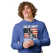 Lightweight hoodie with 'Give Me Liberty or Give Me a Fireball Shot' text, Statue of Liberty holding a shot glass, and distressed American flag background. Perfect for 4th of July."