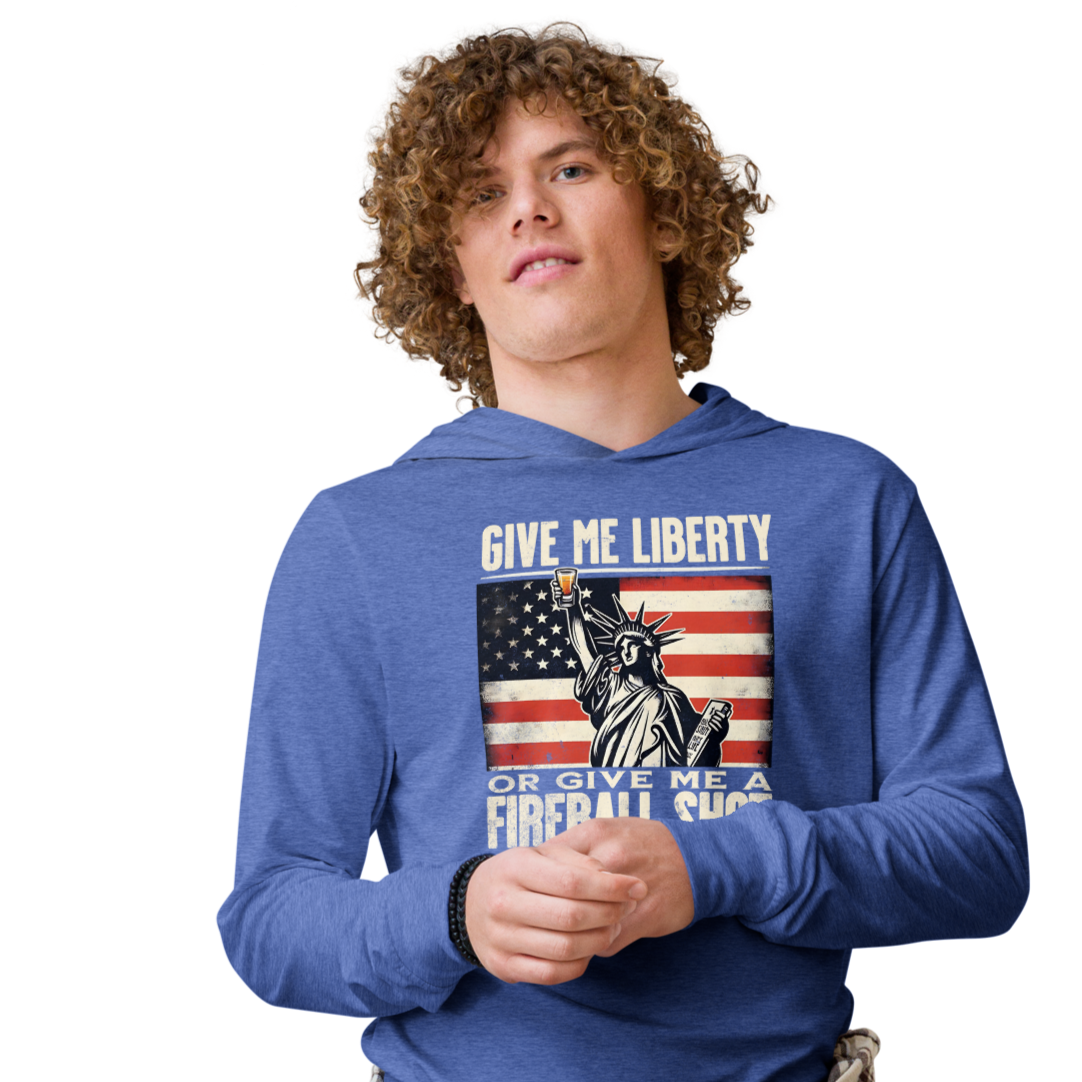 Lightweight hoodie with 'Give Me Liberty or Give Me a Fireball Shot' text, Statue of Liberty holding a shot glass, and distressed American flag background. Perfect for 4th of July."