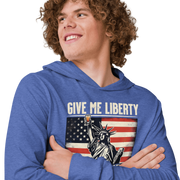 Lightweight hoodie with Give Me Liberty or Give Me a Shot of Tequila text, Statue of Liberty holding a shot glass, and distressed American flag background. Perfect for 4th of July.