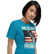 T-shirt with 'Give Me Liberty or Give Me a Fireball Shot' text, Statue of Liberty holding a shot glass, and distressed American flag background.