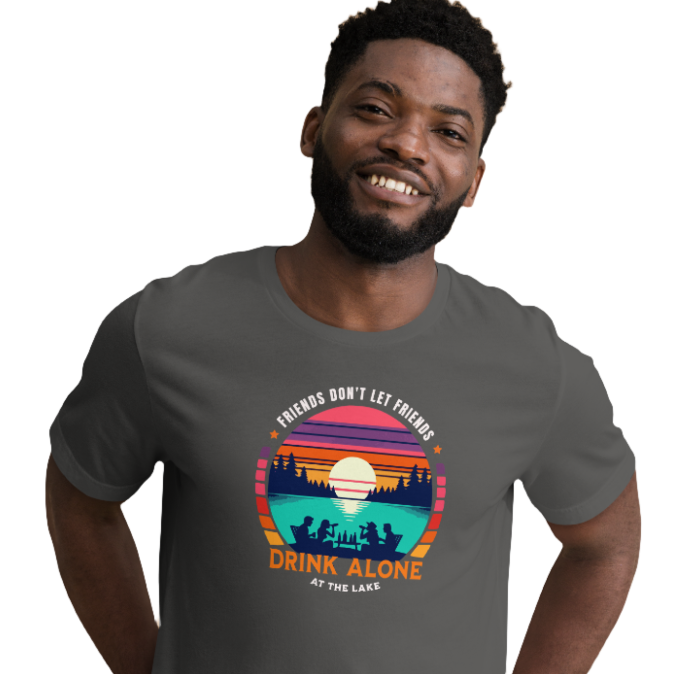 Tee showcasing "Friends Don't Let Friends Drink Alone at the Lake" with a retro sunset and lake scene.