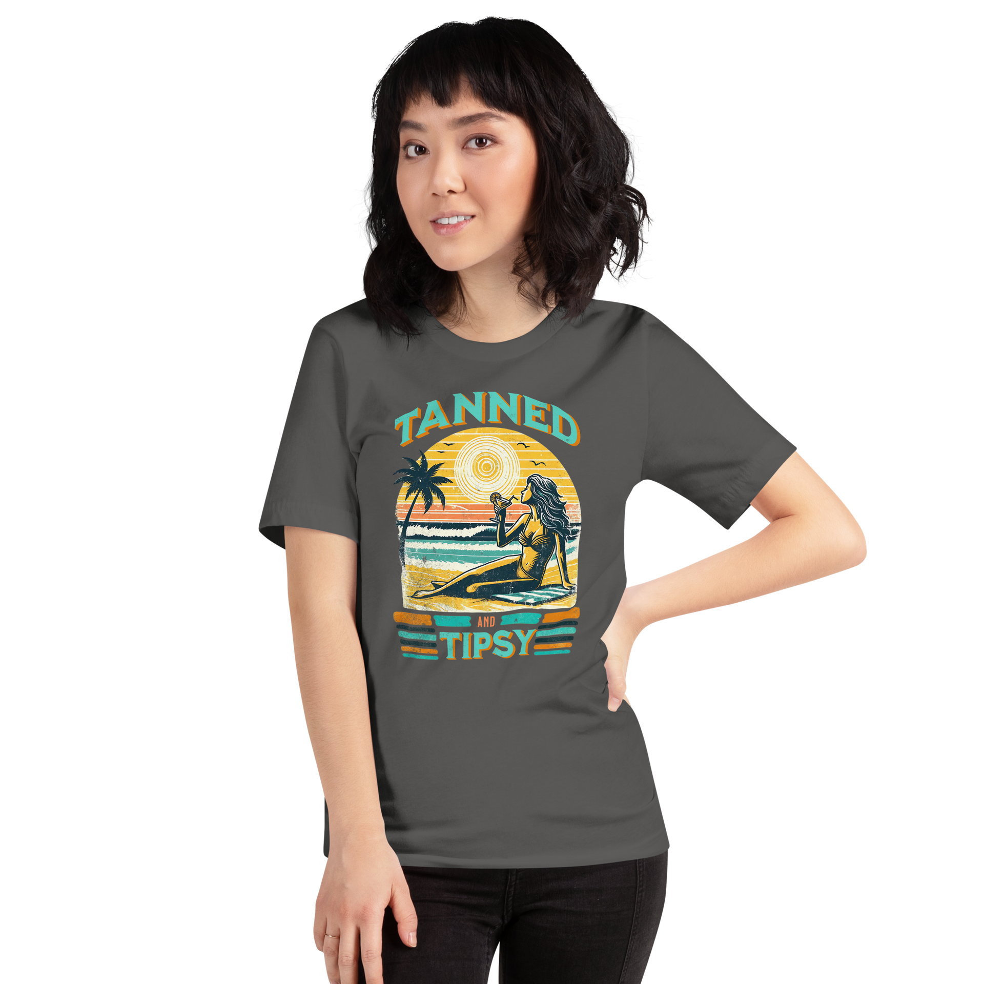 Vintage-inspired 'Tanned and Tipsy' tee with a woman sipping a cocktail on a beach at sunset, perfect for beach drinking and summer parties.