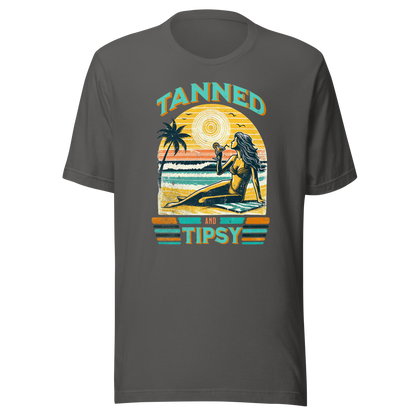 Vintage-inspired 'Tanned and Tipsy' tee with a woman sipping a cocktail on a beach at sunset, perfect for beach drinking and summer parties.