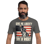 'Give Me Liberty or Give Me Whiskey' text, Statue of Liberty holding a shot glass, and distressed American flag background