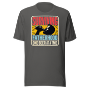 Celebrate fatherhood with our "Surviving Fatherhood One Beer at a Time" t-shirt. Perfect gift for dads who love a cold one. Ideal for Father's Day or birthdays.