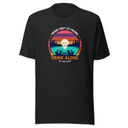 Tee showcasing "Friends Don't Let Friends Drink Alone at the Lake" with a retro sunset and lake scene.