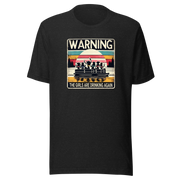 Tee showing "Warning: The Girls Are Drinking Again" with an image of girls on a pontoon boat enjoying drinks at sunset.