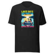 Tee with "Lake Days Are Made for Sipping and Dipping," featuring a woman on a tube float with a cocktail, lake and sunset backdrop.