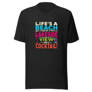 Tee displaying "Life's a Beach but I Prefer It with a Lakeside View and a Cocktail" in bright, eye-catching colors.