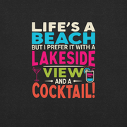 Tee displaying "Life's a Beach but I Prefer It with a Lakeside View and a Cocktail" in bright, eye-catching colors.