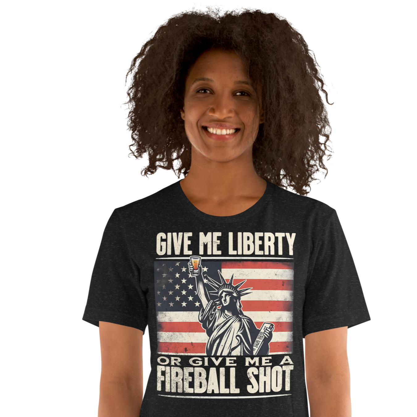 T-shirt with 'Give Me Liberty or Give Me a Fireball Shot' text, Statue of Liberty holding a shot glass, and distressed American flag background.