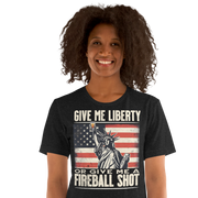 T-shirt with 'Give Me Liberty or Give Me a Fireball Shot' text, Statue of Liberty holding a shot glass, and distressed American flag background.