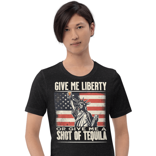 T-shirt with Give Me Liberty or Give Me a Shot of Tequila text, Statue of Liberty holding a shot glass, and distressed American flag background. Perfect for 4th of July.
